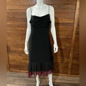 SUZY Sheir.  Black dress with a twist. Large. Burgundy at the bottom.